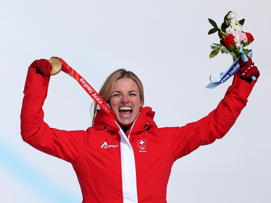 Swiss alpine skier Lara Gut-Behrami celebrates winning her gold medal in the women's Super-G at the Beijing Winter Olympics on February 11, 2022.