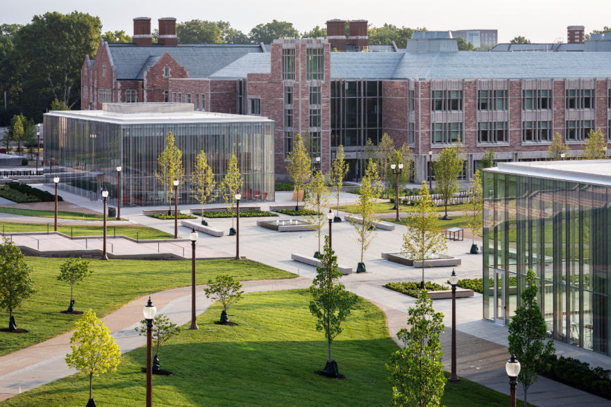 The glass-enclosed Schnuck Pavilion (left) and Sumers Welcome Center sit near Jubel Hall and a pedestrian-friendly green space. All are newly built elements of the campus. [9/27/19]