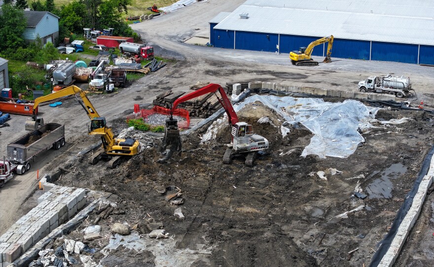 Excavators remove contaminated soil.
