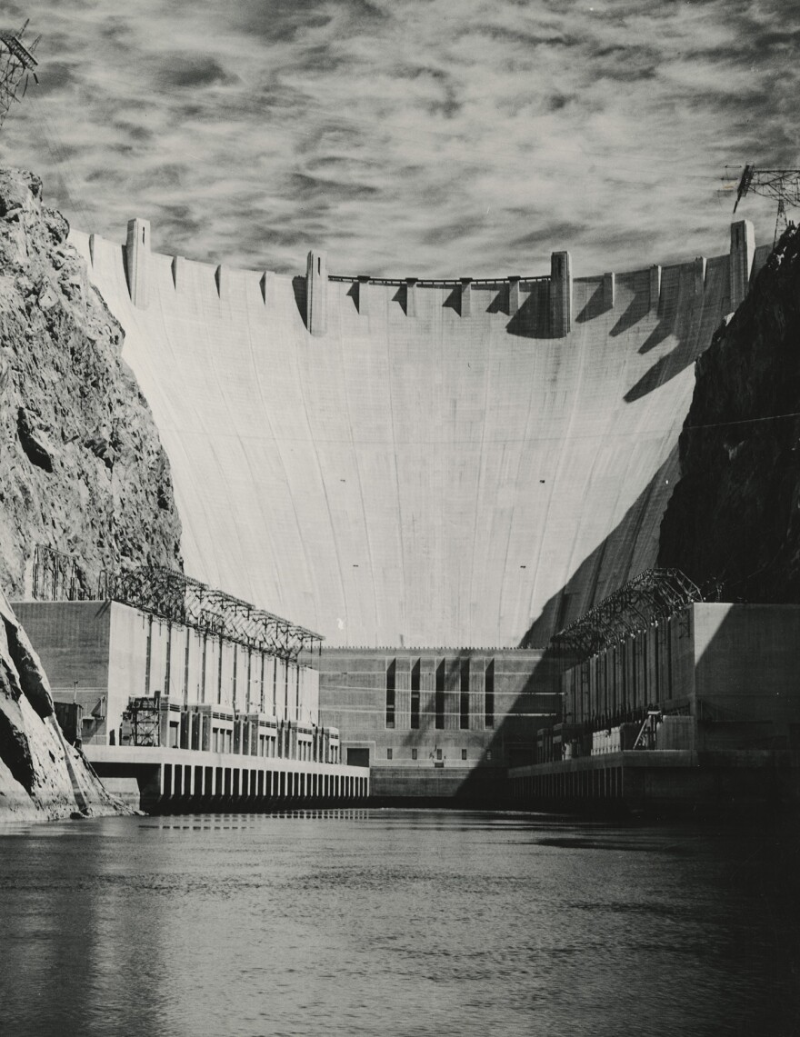 The hoover dam towers above the Colorado River.