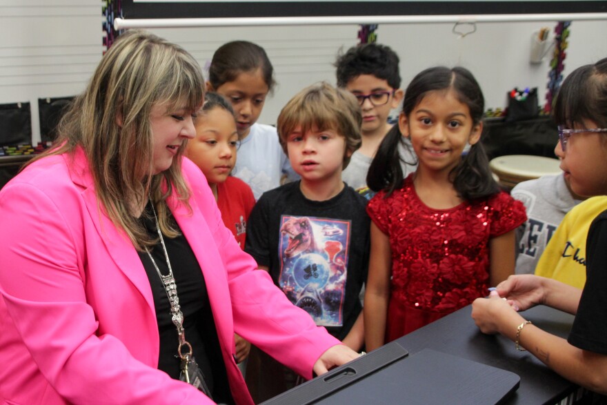 Rachel Marlow, Central Elementary School's music teacher, leads her class in song. She's been designated as the next teacher of the year in Kansas.