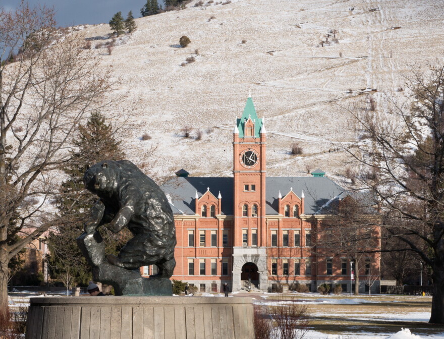 Grizzly statue and Main Hall on the University of Montana campus in Missoula.