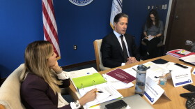 Miami-Dade County schools superintendent Alberto Carvalho (center) and the school district's chief communications officer, Daisy Gonzalez-Diego (left), attend the final meeting of a task force considering the future of WLRN.