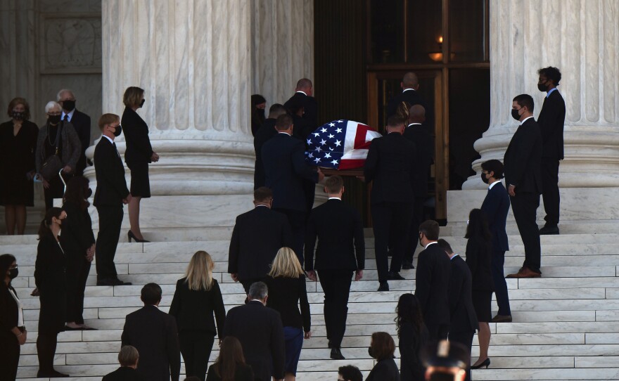 Justice Ruth Bader Ginsburg's casket is carried into the Supreme Court in Washington, D.C., on Wednesday.