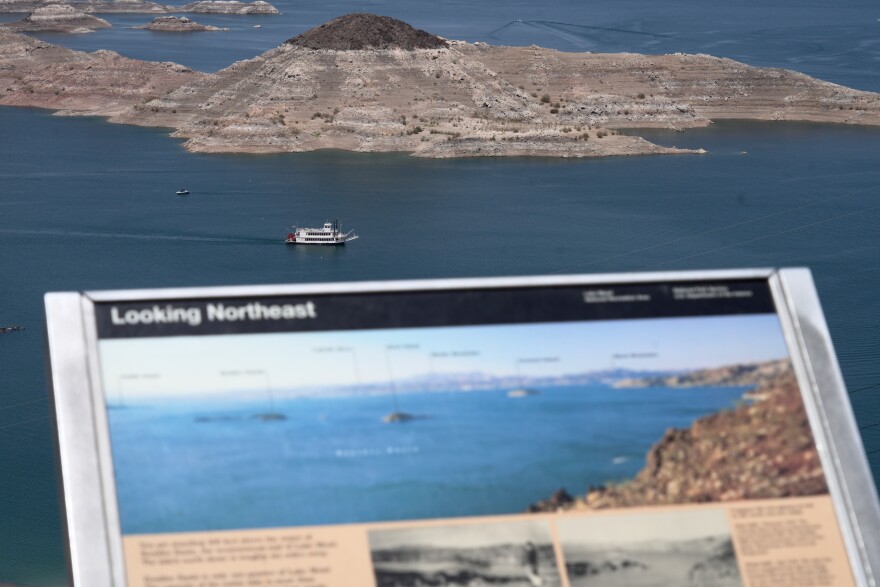 A paddle boat goes past a once nearly submerged island in Lake Mead near Boulder City, Nev., on Friday, Aug. 7, 2026. (AP Photo/Ty ONeil)