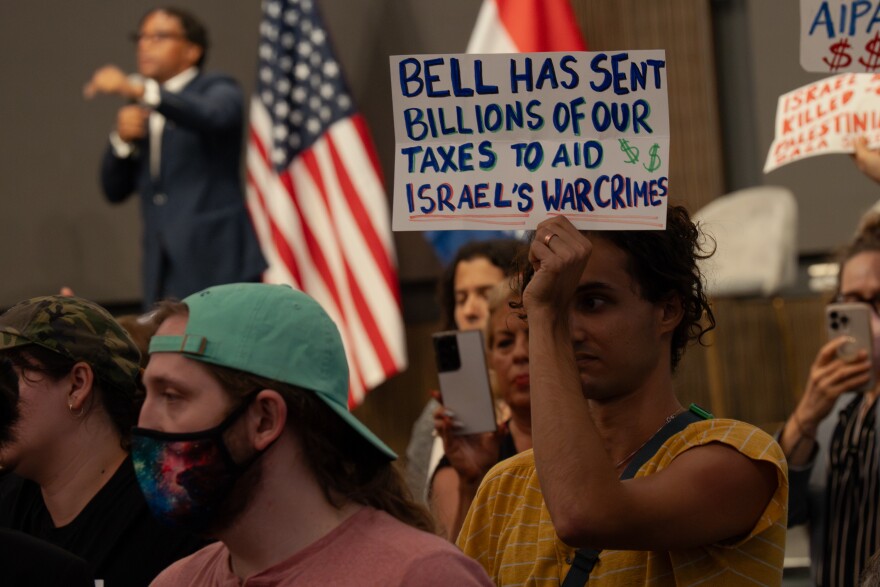 Elior Berkowitz, 32, protests the ties between Israel and U.S. Rep. Wesley Bell, D-St. Louis County, during a town hall meeting held by the congressman at The Post Building on Tuesday, Aug. 19, 2025, in downtown St. Louis.