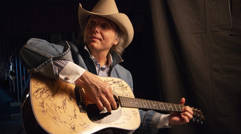 Dwight Yoakam plays a Martin D-28 guitar. Yoakam is among the 76 of the 101 country music artists interviewed for the series who signed two Martin D-28 guitars.