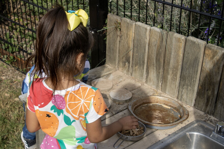 Kids play in the mud kitchen at the Pre-K 4 SA South Education Center on Monday, Oct. 26, 2026. Pre-K 4 SA has helped many community childcare providers develop their outdoor learning spaces.