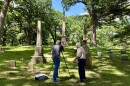 Documentarian Dan Baker at the camera as Randy Harter, County Historian navigates their journey through Lindenwood Cemetery: Fort Wayne