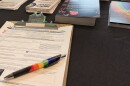 An Ohio voter registration form sits on a table at Stonewall Columbus. The LGBTQ+ organization held an voter registration event at its Short North headquarters in September 2026 ahead of what's expected to be a very consequential midterm election.