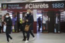 Spectators arrive for the English Premier League soccer match between Burnley and Liverpool at Turf Moor in Burnley, England, Wednesday May 19, 2021. (Alex Livesey/Pool via AP)