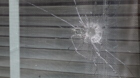 A bullet hole from a police officer's shot is seen in the rear window of Atatiana Jefferson's home in Fort Worth, Texas, Tuesday, Oct. 15, 2019. (Tony Gutierrez/AP)