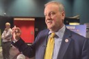 County Executive Sam Page demonstrates how to administer naloxone at a media event at the 24:1 Cinema in Pagedale. 