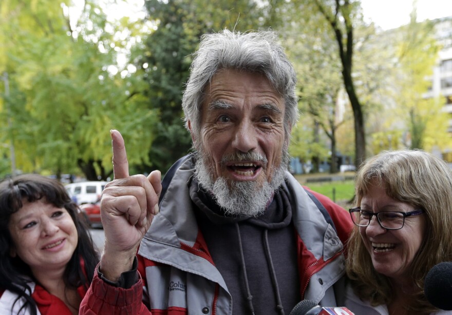 Defendant Neil Wampler speaks as he leaves federal court Thursday in Portland, Ore.