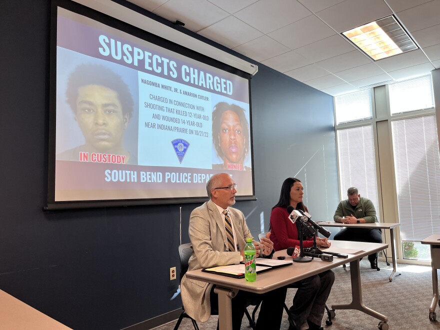 St. Joseph County Prosecutor Ken Cotter, left, speaks to members of the media on Monday, Nov. 13, 2023 to announce murder charges have been filed against two men in the killing of 12-year-old Josiah Small.