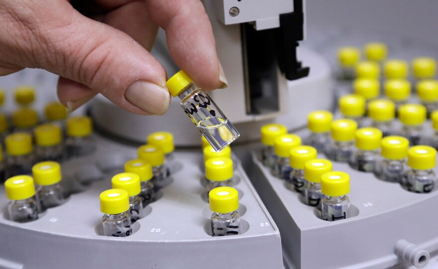 Vials are prepared to test medical marijuana at Sunrise Analytical lab in Wilsonville, Ore.