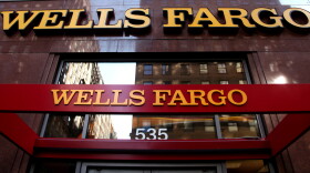 In this May 6, 2012, file photo, a Wells Fargo sign is displayed at a branch in New York.