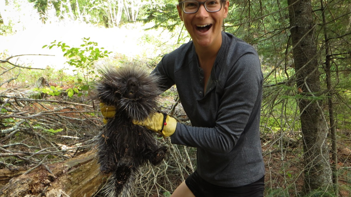 Charlie Mitchell, beaming with delight, holds a porcupine in Canada on August 19, 2018.