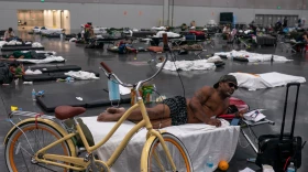 Kermic Luster rests in a cooling center at the Oregon Convention Center on June 27, 2021 in Portland, Oregon.