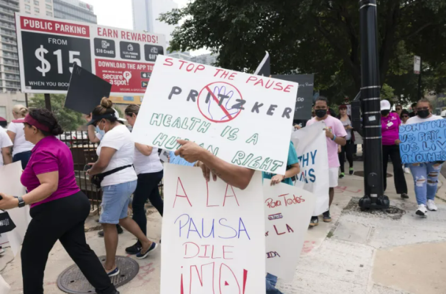 In June, protesters gathered outside Illinois state offices at 555 W. Monroe St. in Chicago to oppose changes to healthcare coverage for undocumented persons.