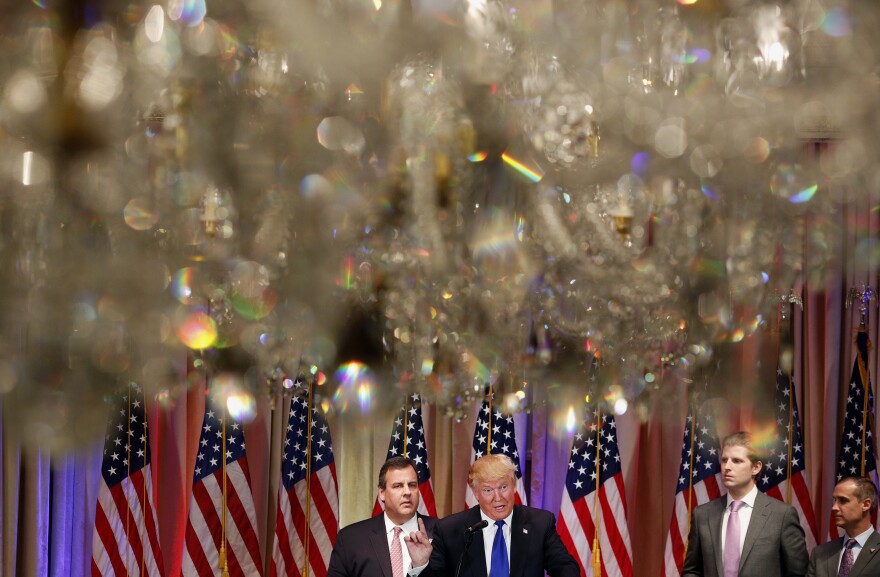 Donald Trump speaks onstage as New Jersey Gov. Chris Christie (left) stands nearby during a Super Tuesday night event at Trump property Mar-a-Lago in Palm Beach, Fla.