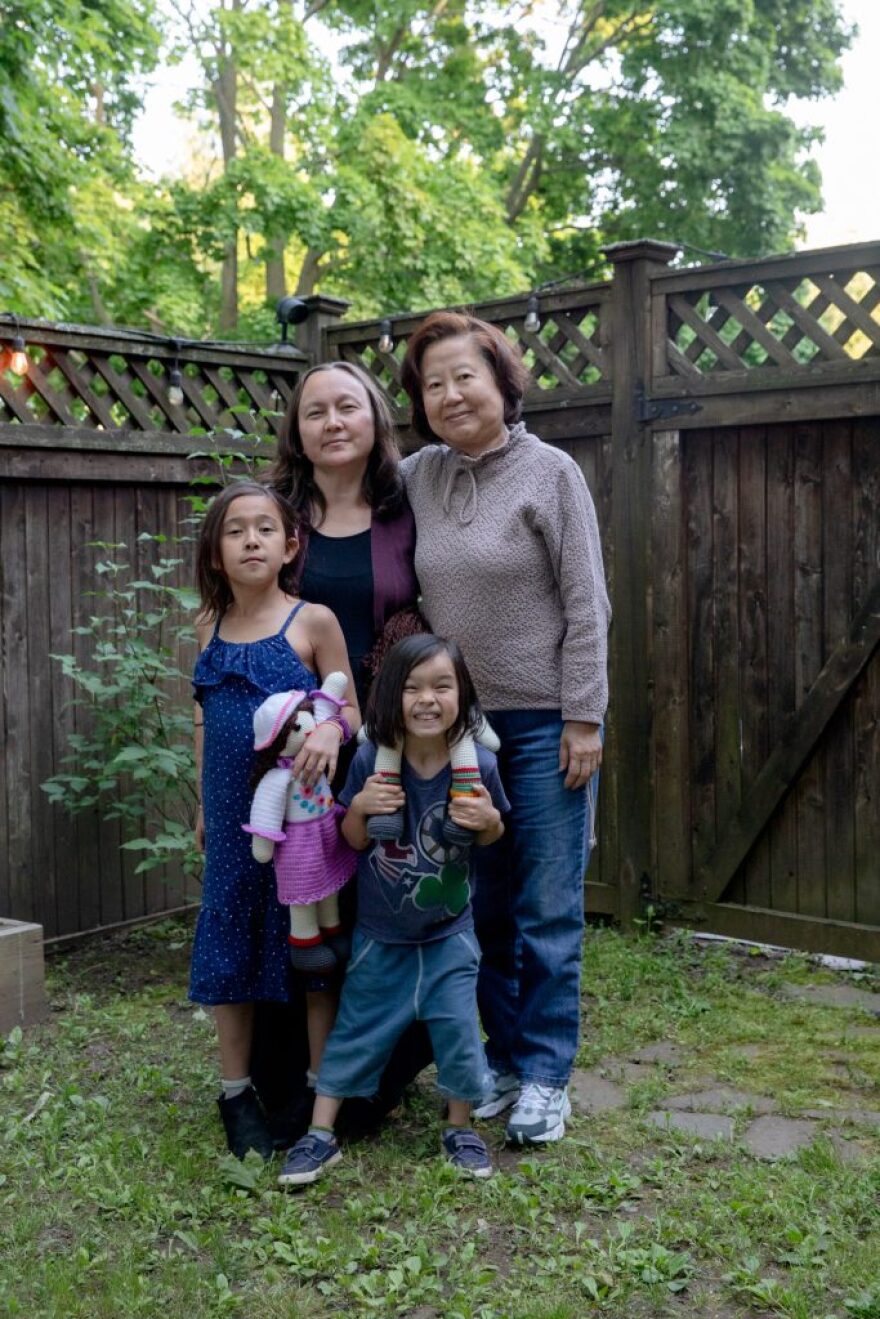 A portrait of Jennifer Heikkila Díaz, their aunt Choyeon Ock Lee, of Orange, and Diaz's children Magdalena Yoon-Jae Díaz, left, and Gabriela Mi-Ja Díaz in their back yard in New Haven.