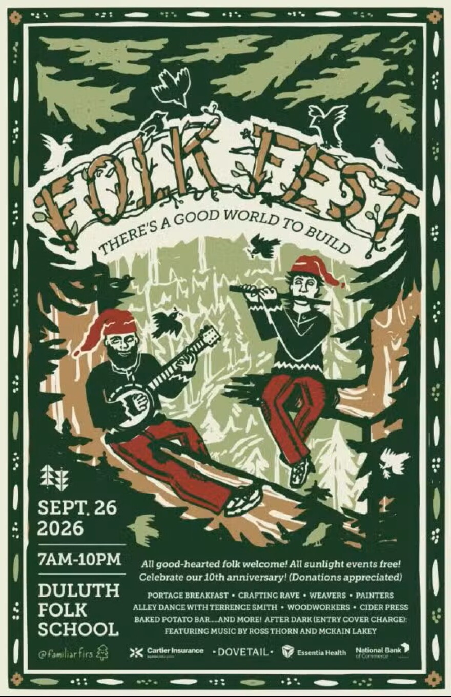Image of two people sitting in tree branches wearing green long sleeves, red pants, and a red cap on. One person has a beard. The person with a beard is playing the banjo, the other is playing the flute. The poster is for Folk Fest which is written in tree branches. It reads "Folk Fest There's a good world to build". 