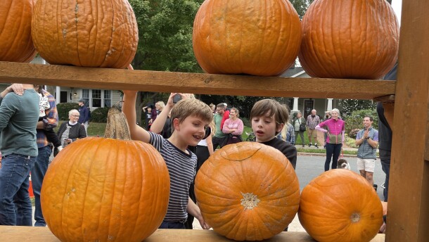 Eight year-olds Harrison Reininger and Lucas Lopez-Snow check out the "Great Pumpkin Wall" on Greenway Avenue on Oct. 27, 2024.
