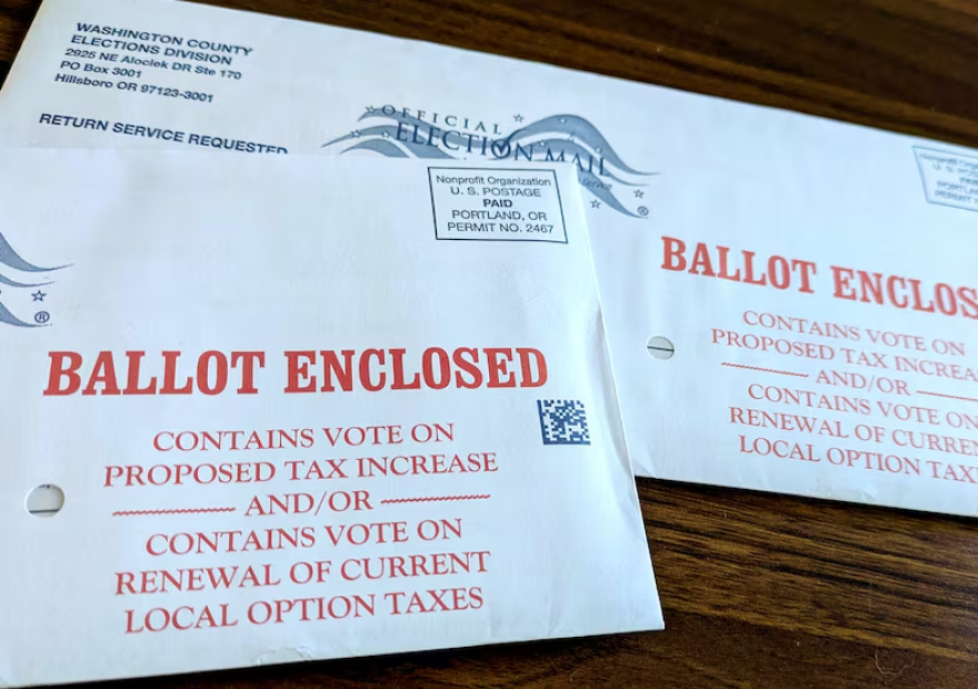 Two unopened Washington County ballots for Oregon's 2026 primary election sit on a table.
