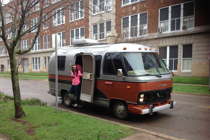 Executive Director Carol Zombro steps out of the Fancy Pants Theater motorhome in the Kalamazoo Vine Neighborhood