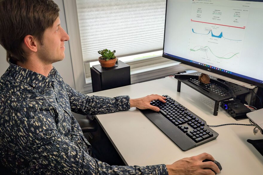 Wingsuit world and national champion Alexey Galda at his home office in Sandy, Utah, looking at GPS data gathered during a training jump, Sept. 28, 2025. He’s analyzing whether the new combination of body position and speed resulted in an improved result. He uses the data to improve his flying skills.