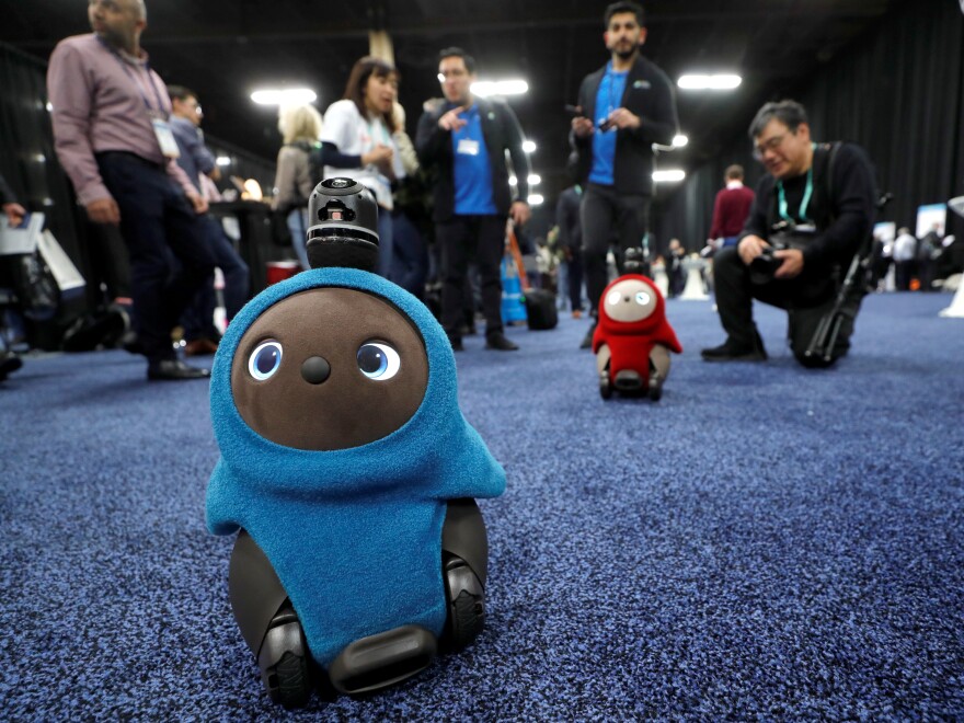 Lovot companion robots by Groove X wander at the Consumer Electronics Show in Las Vegas.