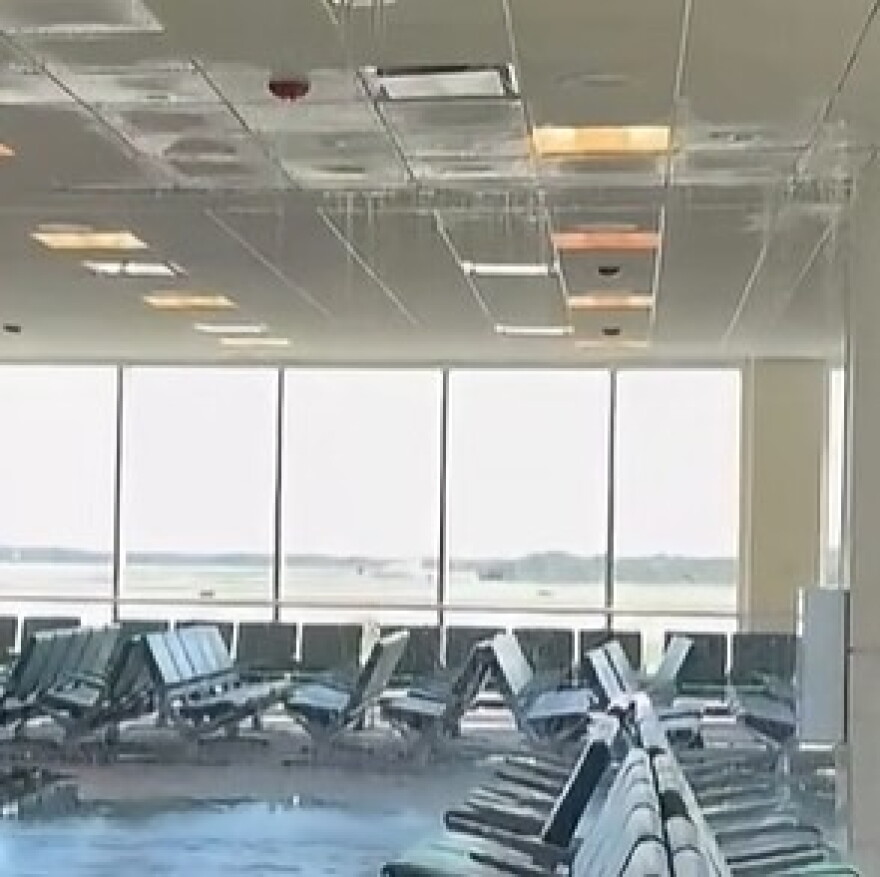 Water cascades from the ceiling in Terminal D at RSW Saturday after a bolt on a chilled water line broke. An airport official said Sunday that the line was quickly fixed and cleanup nearly completed.