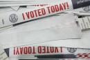 a paper wristband that says "I voted today!" in red block lettering
