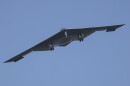 A B-2 bomber flying in the sky. 
