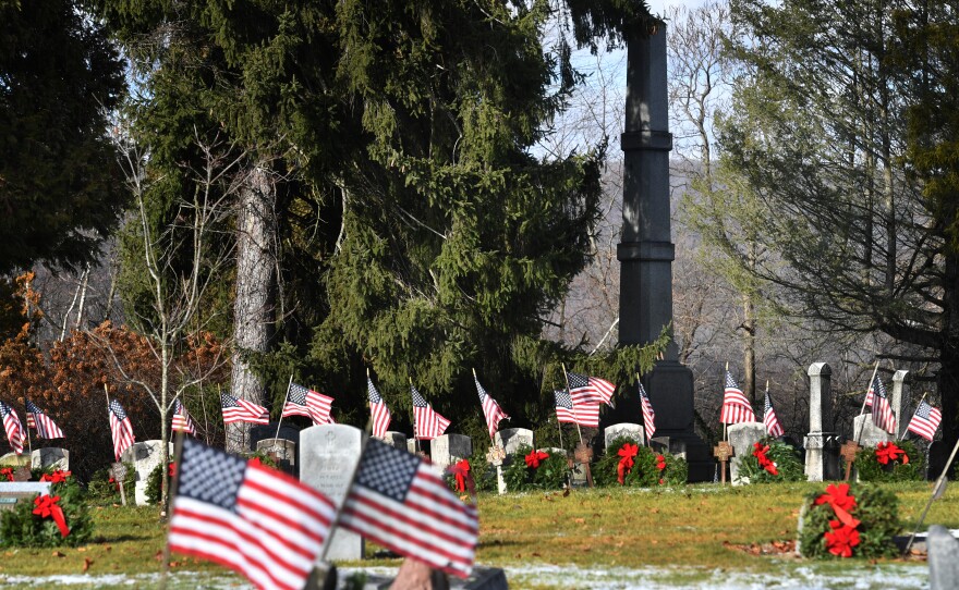 Flags wave and wreaths are seen resting at veteran grave sites in the Hanover Green Cemetery.