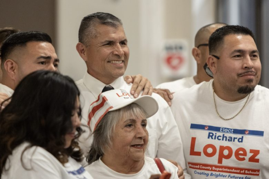 Richard Lopez, candidate for Merced County Superintendent of Schools, poses for photos with supporters following a debate in Merced, Calif., on Tuesday, Sept. 29, 2026.