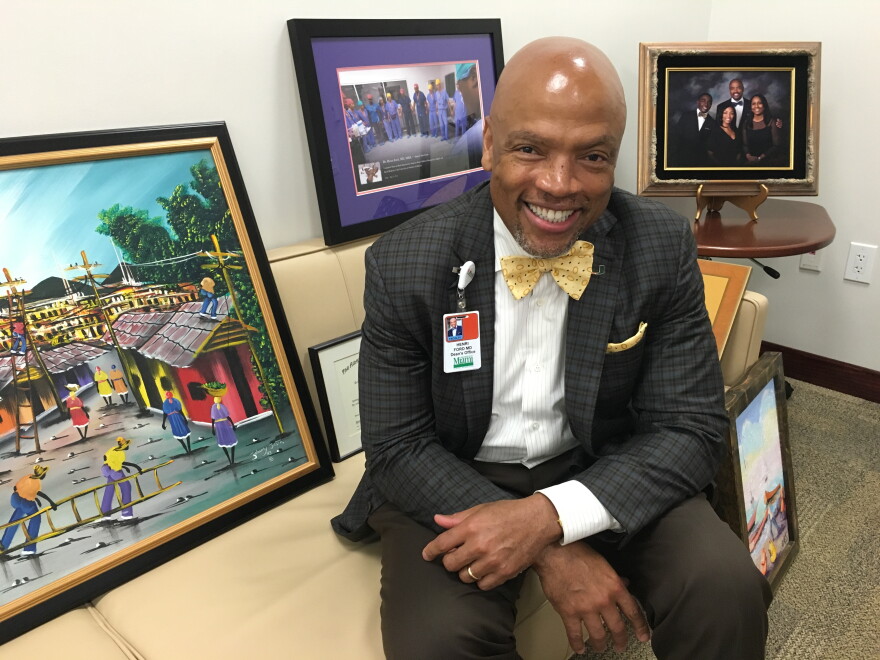 Dr. Henri Ford is the new dean at the University of Miami Miller School of Medicine. His diplomas and art were waiting to be hung in his new office.