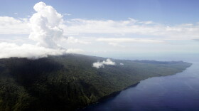 FILE - Steam billows from Lake Vui in the volcano crater of Mount Manaro on the island of Ambae, part of the Vanuatu islands chain, on Dec. 8, 2005.