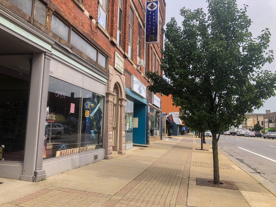 Small businesses line the sidewalk of Mitchell St. in Cadillac.