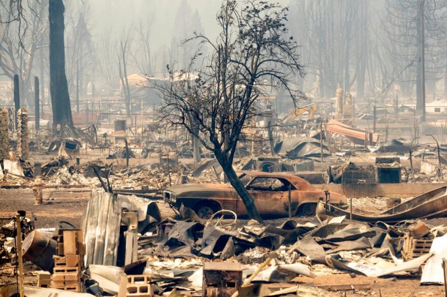 Homes and cars destroyed by the Dixie Fire line central Greenville on Thursday, Aug. 5, 2021, in Plumas County, Calif.