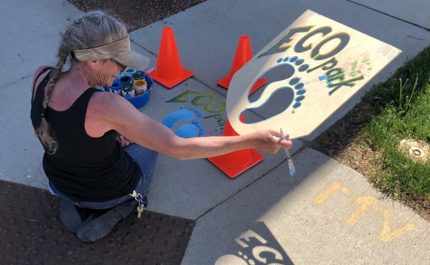 Artist Marina Lee creating stencil to guide walkers to Paliafito Eco-Arts Park.