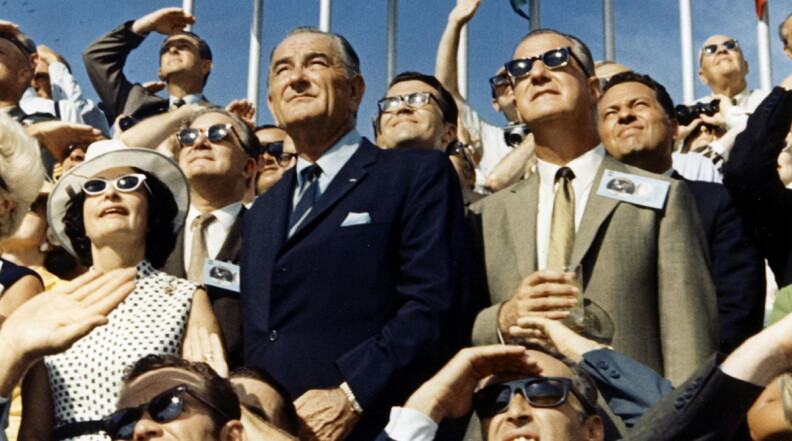 Former President Lyndon B. Johnson (left center) and Vice President Spiro Agnew (right center) view the liftoff of Apollo 11.