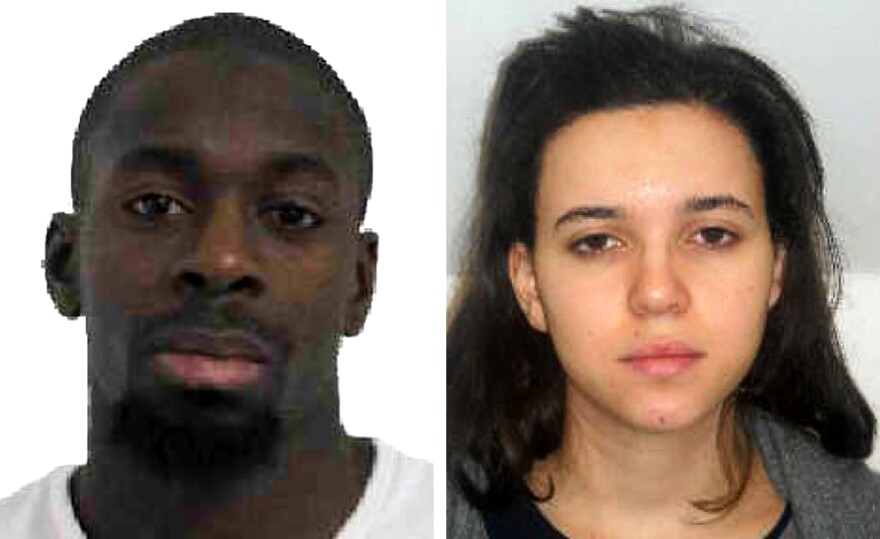 Amedy Coulibaly, seen in a police handout photo, was killed during a hostage situation at a kosher grocery in Paris on Friday. The whereabouts of Hayat Boumeddiene, at right, are unknown. French officials say she was involved in the killing of a policewoman in Paris on Thursday and possibly involved in the standoff at the market.