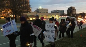 Marchers opposed to the county council's proposed redistricting map make their way along Bosley Avenue Tuesday night. Credit: John Lee