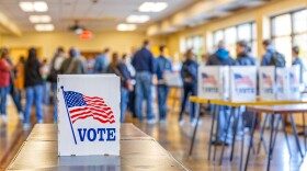 Vote booth at a busy polling station, USA Election Day, wide, copyspace, blurred background