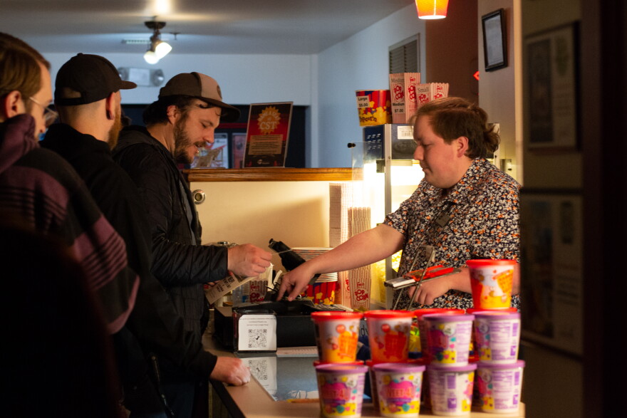 Patrons buy concessions at Court Square Theater before the start of the show.