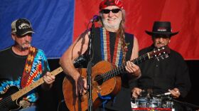 Paul English, right, backing up Willie Nelson on the brushes at a show in 2009.