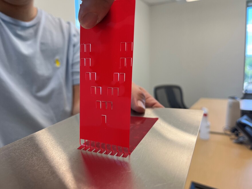 The team of researchers used a laser cutter, and in 10 seconds, carved dozens of little flaps into the tape. The flaps are about the size of a tic tac and makes tape 60 times stronger. 
