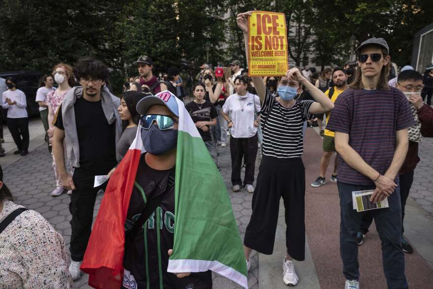 A demonstrator with carrying a Mexican flag chants during a protest against deportation by Immigration and Customs Enforcement in New York, Wednesday, June 11, 2025.